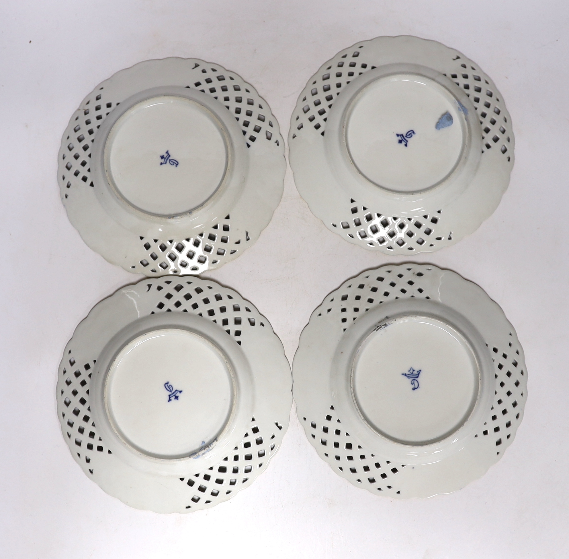 A set of four Dresden blue porcelain cabinet plates decorated with flowers, 21cm